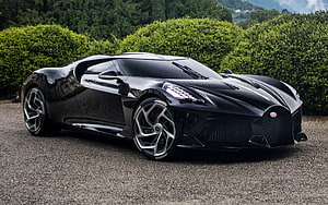 Black Bugatti La Voiture Noire Hypercar Parked on Gravel with Lush Green Hedges HD wallpaper