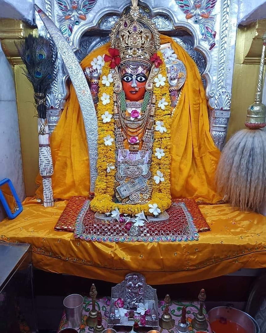 Ashapura Maa Temple Deity Adorned in Marigold Garlands and Golden Silk HD phone wallpaper
