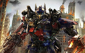 Optimus Prime Standing in a Burning Cityscape from the Transformers Film Series HD wallpaper