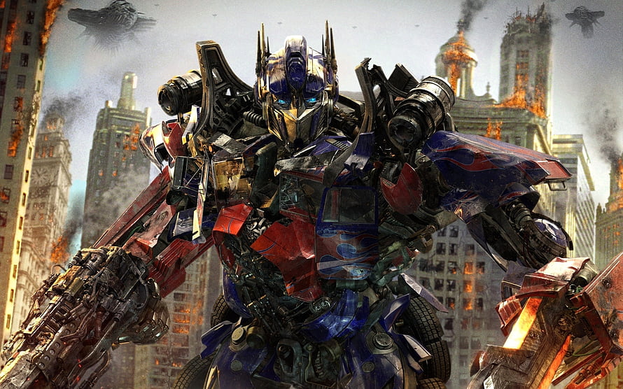 Optimus Prime Standing in a Burning Cityscape from the Transformers Film Series HD wallpaper