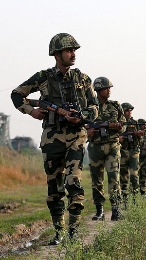 Indian BSF Soldiers in Camouflage Uniforms Standing Guard with Rifles HD phone wallpaper