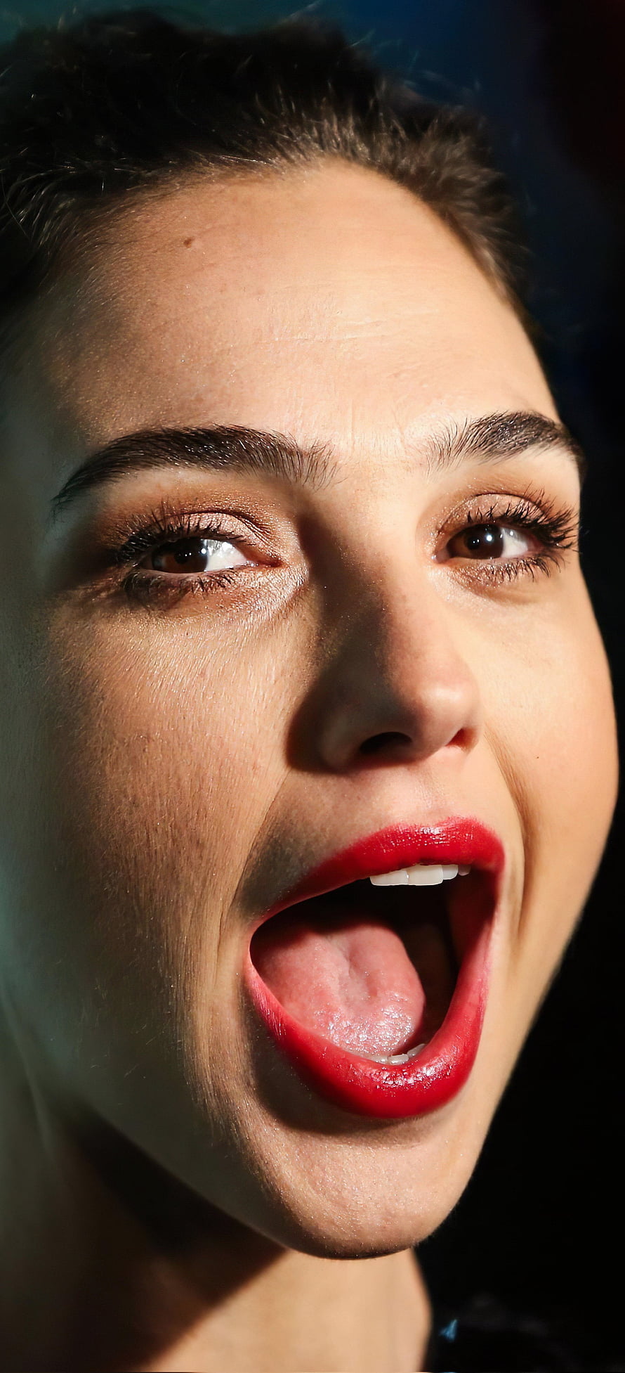 Gal Gadot Close-Up Portrait with Bold Red Lipstick and Dramatic Studio Lighting HD phone wallpaper