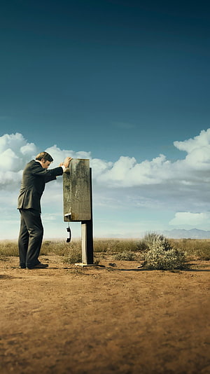 Better Call Saul man in suit leaning on weathered payphone in vast desert landscape, Better Call Saul . Moviemania. Better call saul, Better call saul breaking bad, Call saul, Saul Goodman HD phone wallpaper