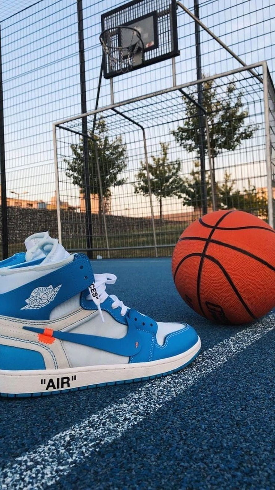 Off-White x Air Jordan 1 Blue and White Sneakers on Basketball Court HD phone wallpaper