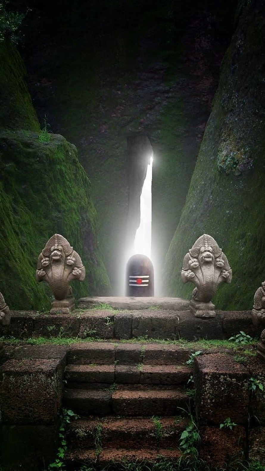 Mystical Shiva Lingam Shrine in Mossy Cave with Guardian Statues HD phone wallpaper