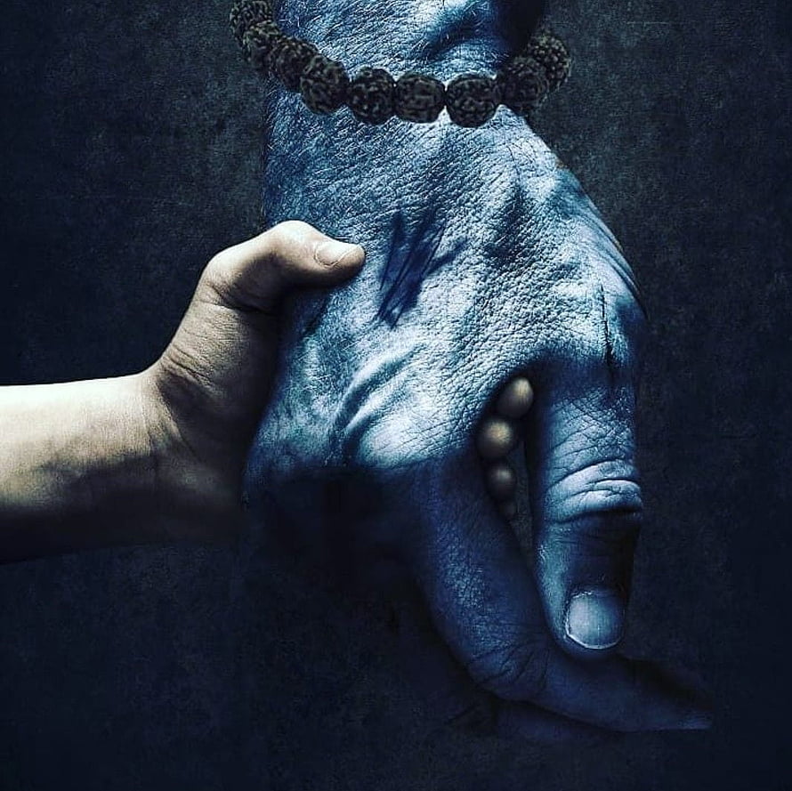 Blue textured hand with prayer beads holding a smaller human hand in dark moody lighting, Lord Shiva Angry High Resolution, Shiva Dark HD wallpaper