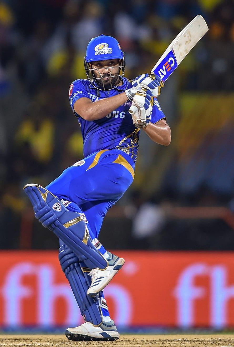 Rohit Sharma playing a shot in Mumbai Indians blue jersey during an IPL cricket match HD phone wallpaper