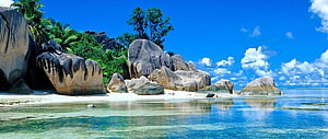 Tropical Island Beach with Giant Granite Boulders and Turquoise Water HD wallpaper