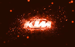 KTM Logo Glowing in Fiery Orange Sparks and Neon Light Burst HD wallpaper