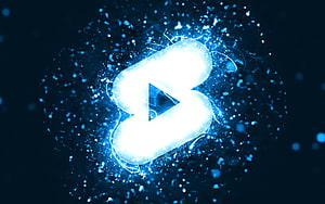 Glowing YouTube Shorts Logo with Electric Blue Neon Particles and Abstract Digital Background HD wallpaper