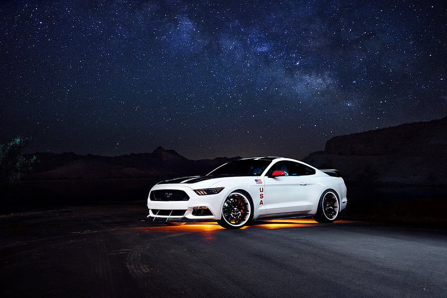 White Ford Mustang GT with Underglow Parked Under the Milky Way Night Sky HD wallpaper