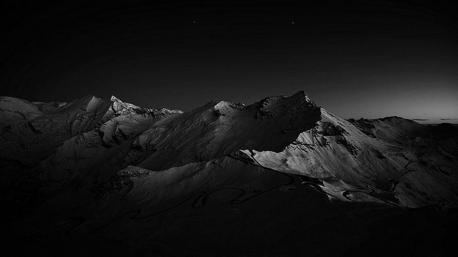 Monochrome Nighttime Mountain Range with Snow-Capped Peaks and Winding River HD wallpaper
