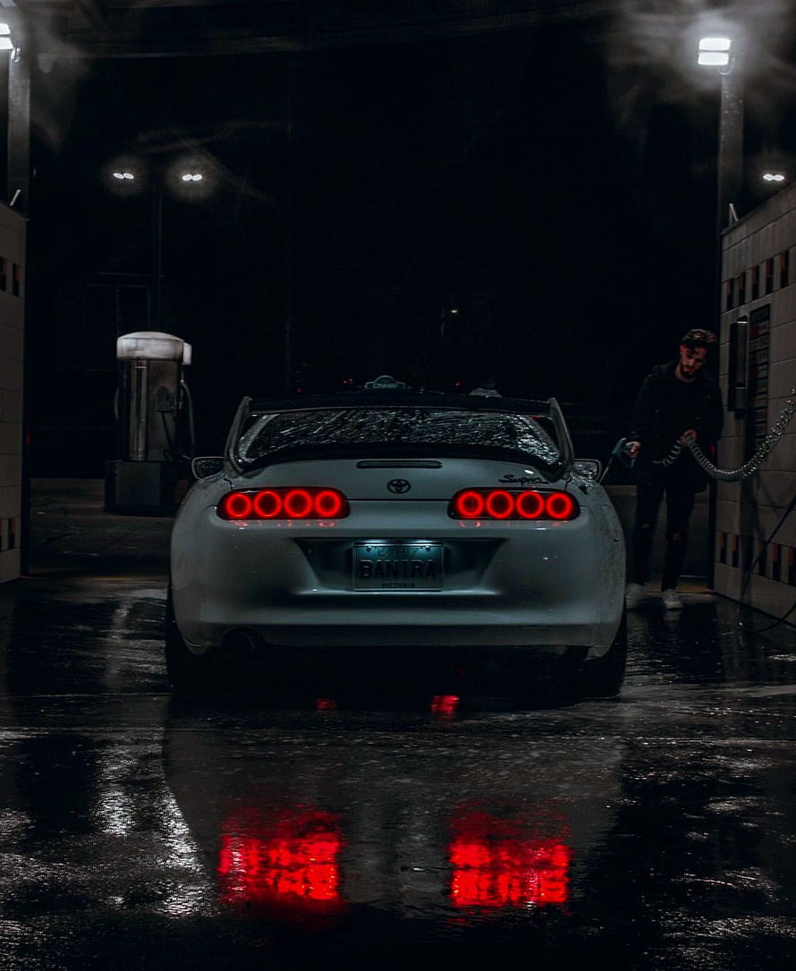 White Toyota Supra MK4 at Night Car Wash with Red Taillights Reflection HD phone wallpaper