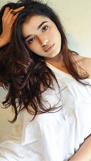 Ketika Sharma Portrait in White Top with Long Wavy Hair HD phone wallpaper