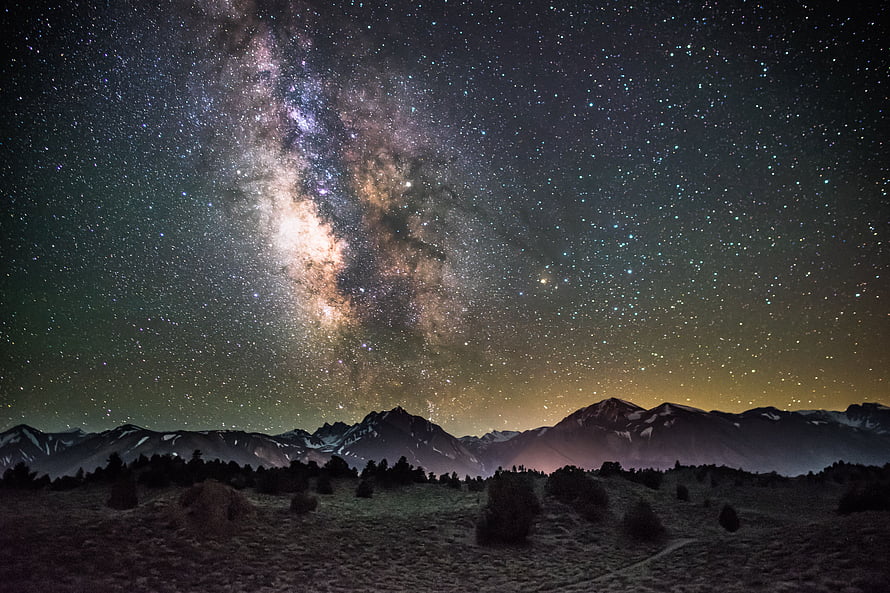 Stunning Milky Way Galaxy Over Snow-Capped Mountain Range at Night HD wallpaper