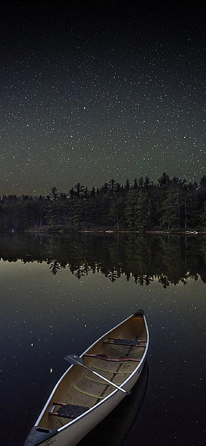 Canoe on a Starlit Lake at Night with Forest Reflections HD phone wallpaper