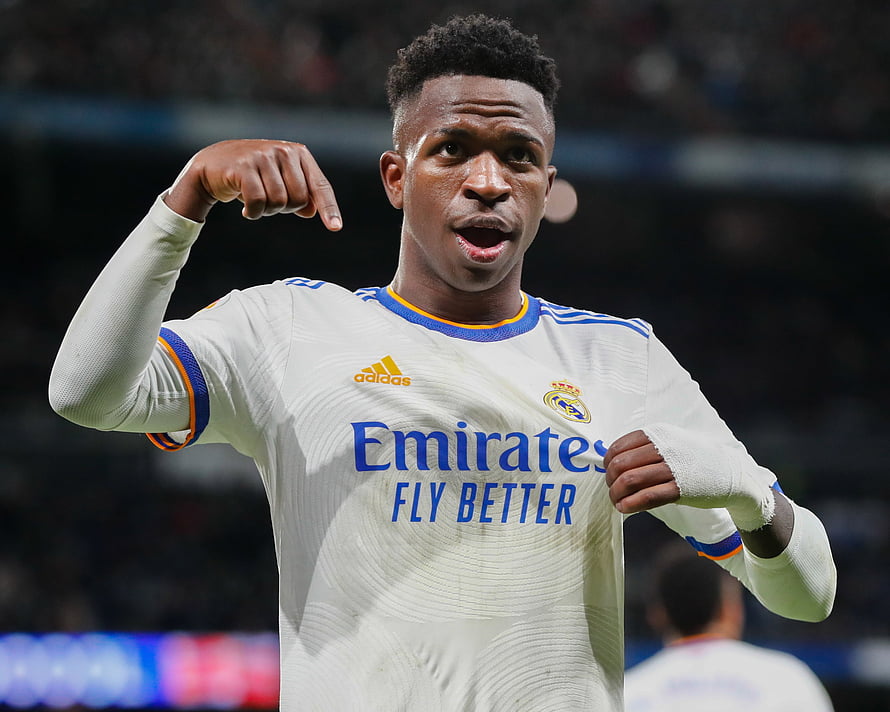 Vinicius Junior in Real Madrid White Home Kit Pointing Down During Match HD wallpaper