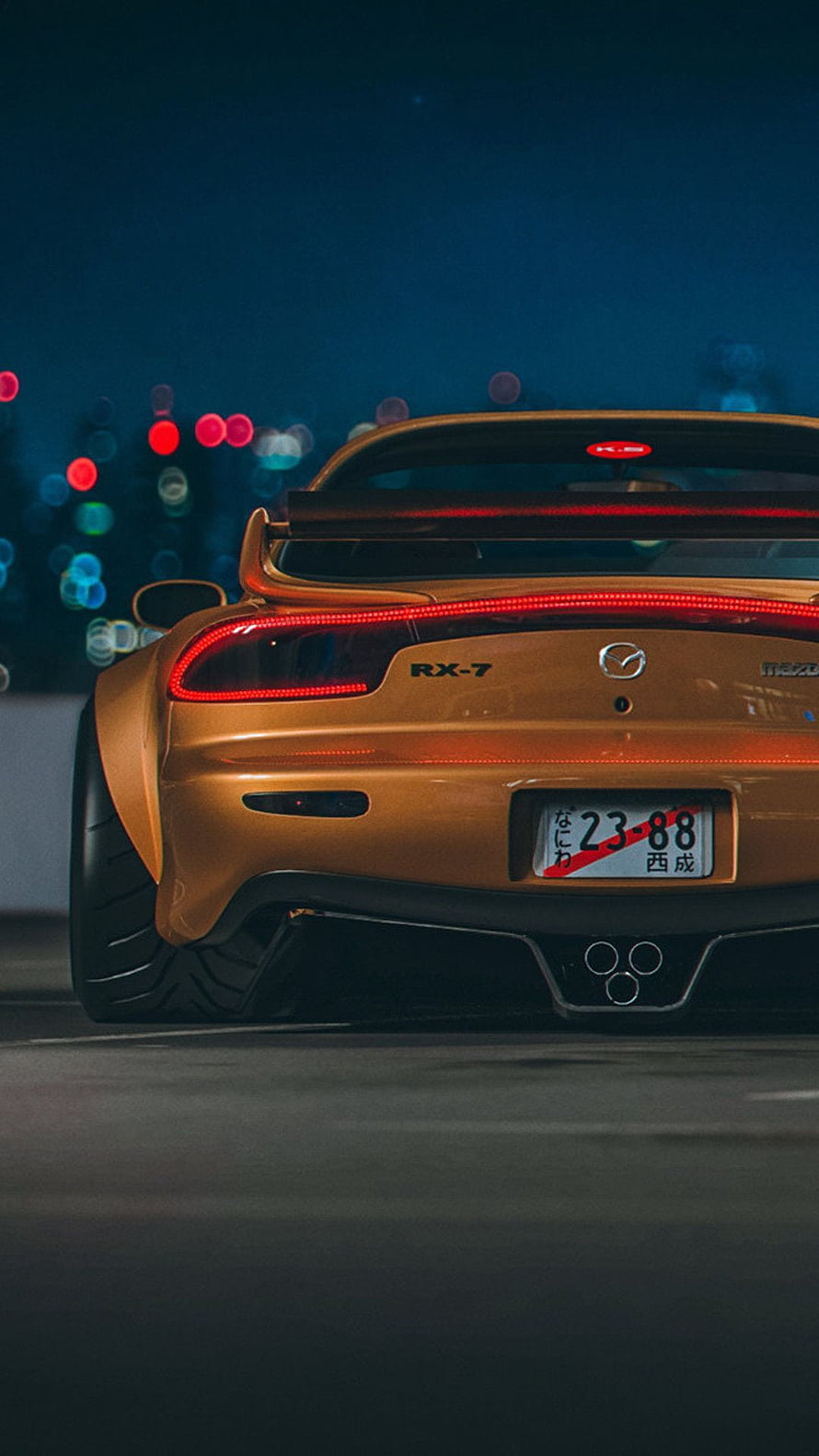 Mazda RX-7 Rear View at Night with Bokeh City Lights and JDM Style HD phone wallpaper