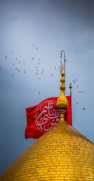 Golden Dome and Red Flag at Karbala Shrine with Birds in the Sky HD phone wallpaper