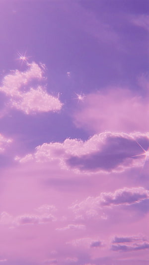 Dreamy Purple Sky With Fluffy Clouds And Sparkling Starbursts HD phone wallpaper