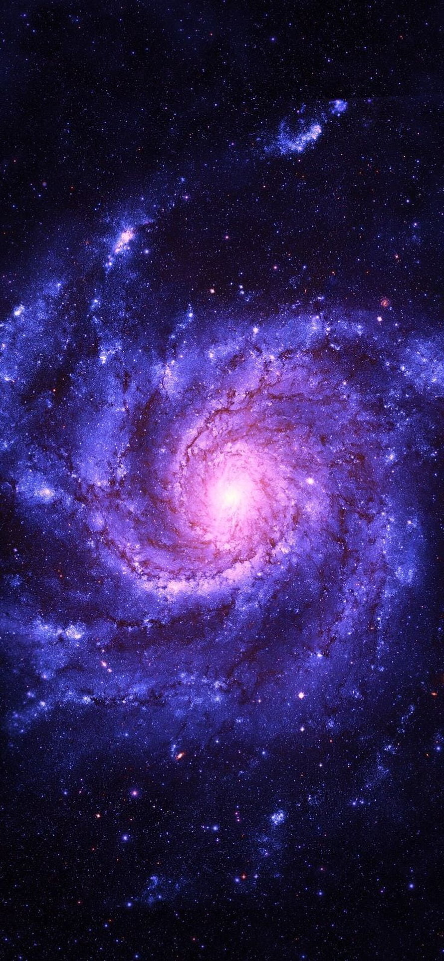 Vibrant Purple Spiral Galaxy with Bright Core and Star-Scattered Deep Space Background HD phone wallpaper