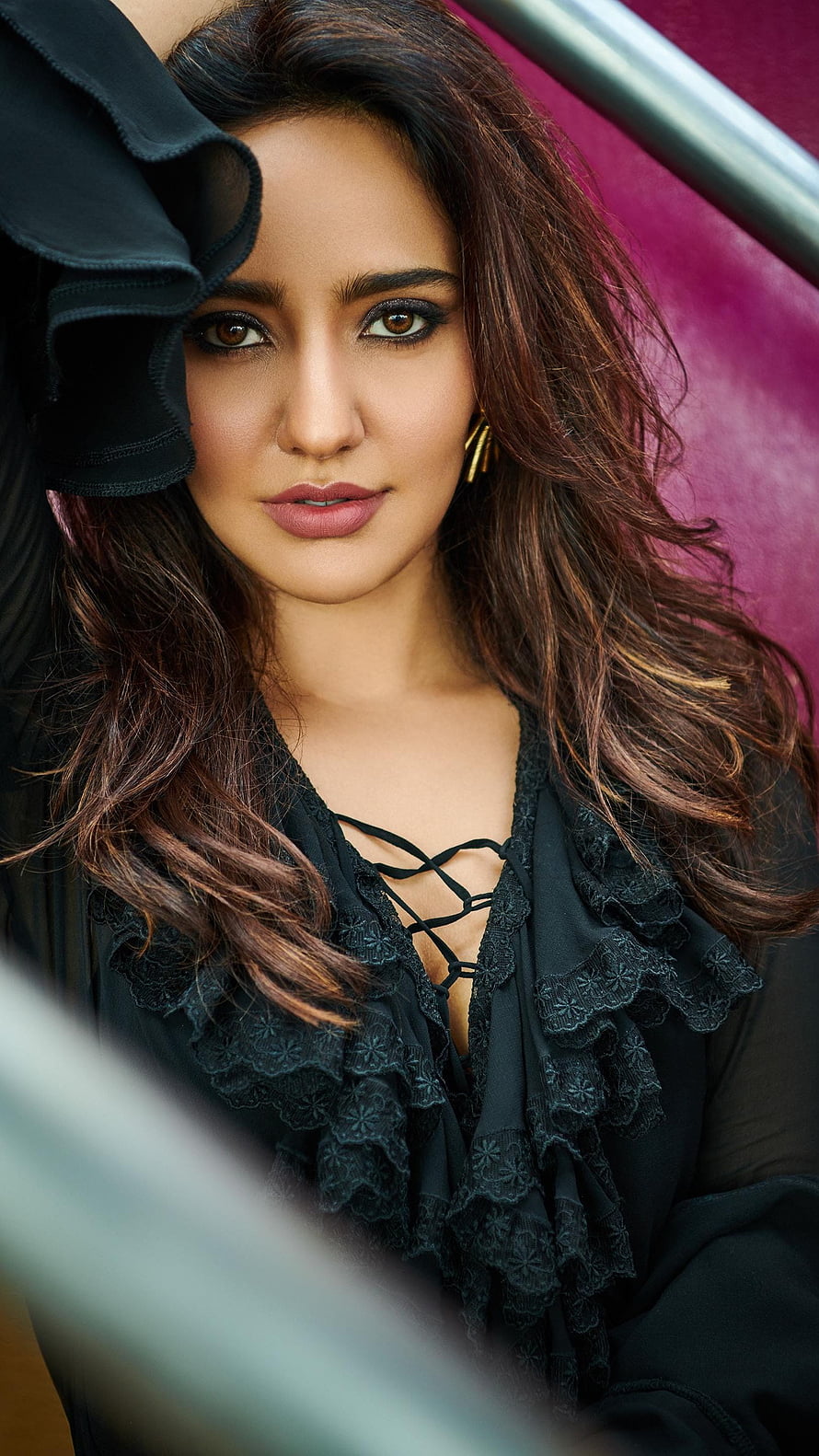 Elegant portrait of Bollywood actress Huma Qureshi wearing a black lace top with a pink background HD phone wallpaper