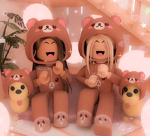 Cute Roblox avatars in matching brown bear hoodies sitting with plush toys in a cozy pink room HD wallpaper