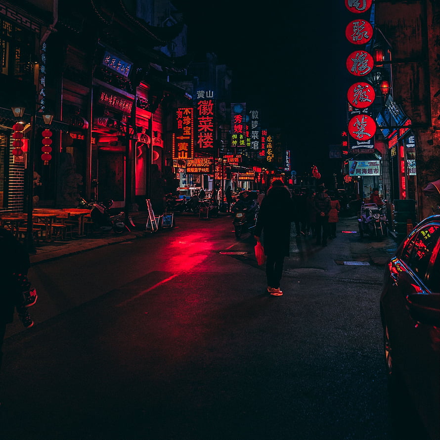 Neon-lit Chinese street at night with glowing red lanterns and signs HD phone wallpaper