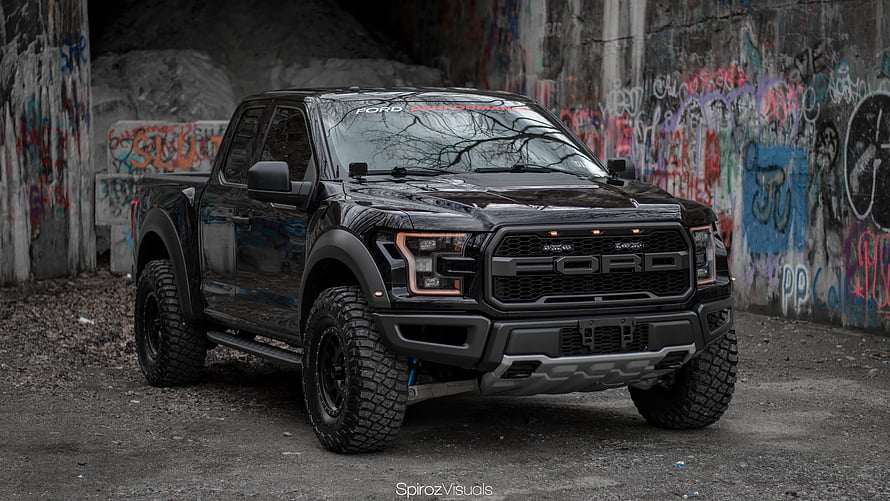 Black Ford F-150 Raptor Pickup Truck Parked in Urban Graffiti Tunnel HD wallpaper