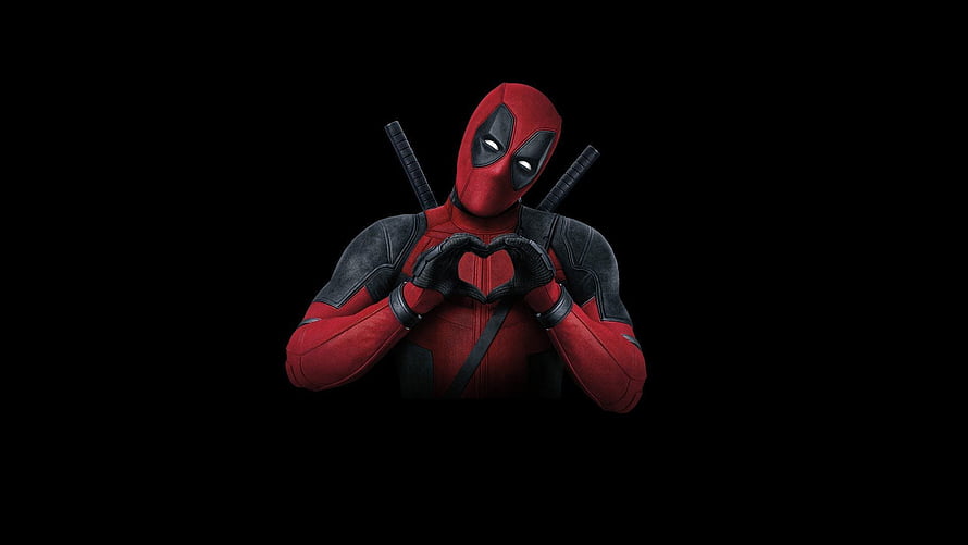 Deadpool Making a Heart Shape with Hands Against a Black Background HD wallpaper
