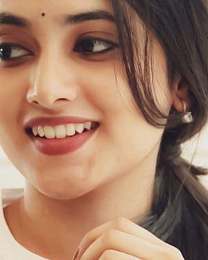Priyanka Arul Mohan Close-Up Portrait with Warm Smile and Dark Hair HD phone wallpaper