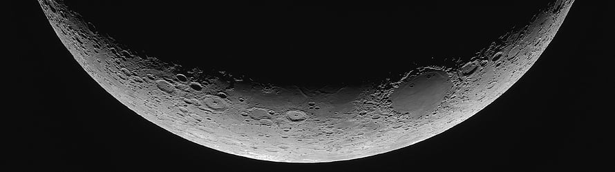 Crescent Moon Cratered Surface Against Deep Black Space HD wallpaper