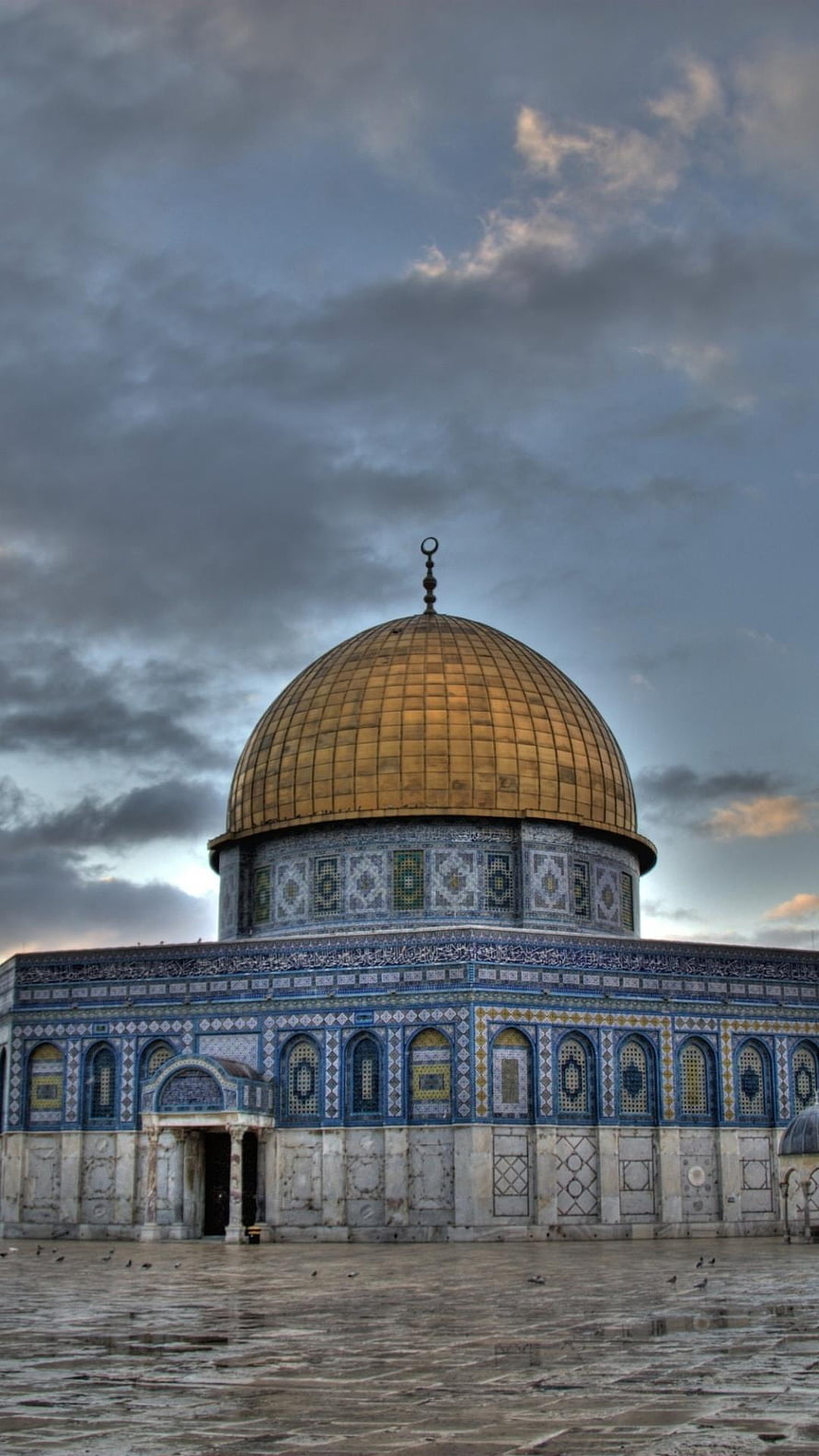 Dome of the Rock in Jerusalem with golden dome and intricate tilework under a dramatic cloudy sky HD phone wallpaper