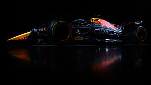 Red Bull Racing Oracle Formula One Car on Dark Reflective Surface HD wallpaper