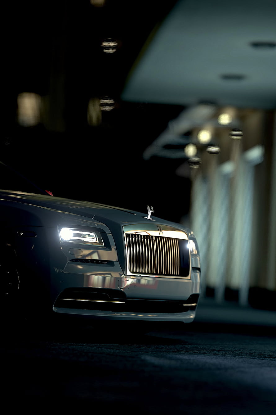Silver Rolls-Royce Ghost Front View at Night with Illuminated Headlights and Spirit of Ecstasy HD phone wallpaper