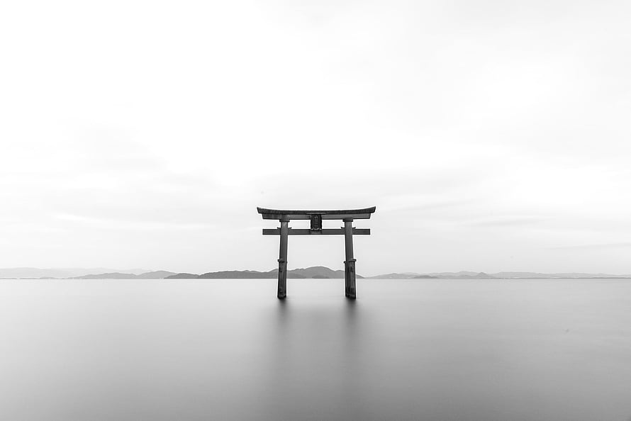 Minimalist Black and White Photography of a Torii Gate Standing in Calm Water HD wallpaper