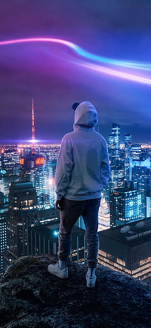Hooded Figure Standing on Rooftop Overlooking Neon City Skyline at Night HD phone wallpaper