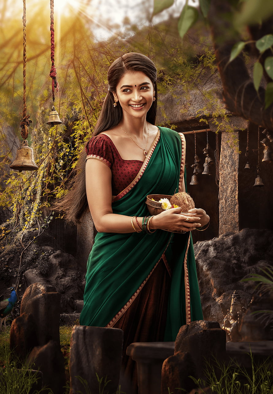 Pooja Hegde in Green Saree Holding Coconut and Flowers in Temple Setting HD phone wallpaper