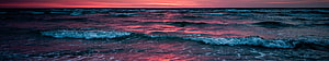 Vibrant Pink and Blue Sunset Over Ocean Waves HD wallpaper