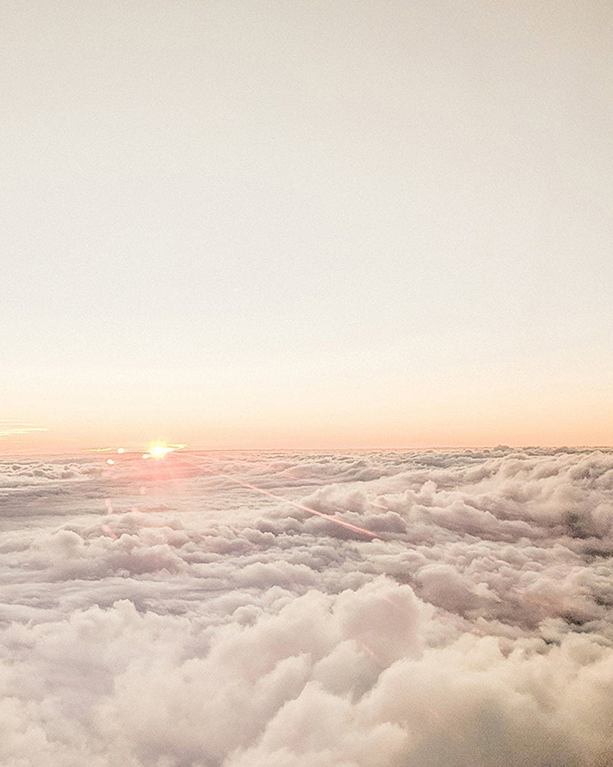 Sunrise Above the Clouds: A Serene Pastel Sky and Fluffy White Cloudscape HD phone wallpaper