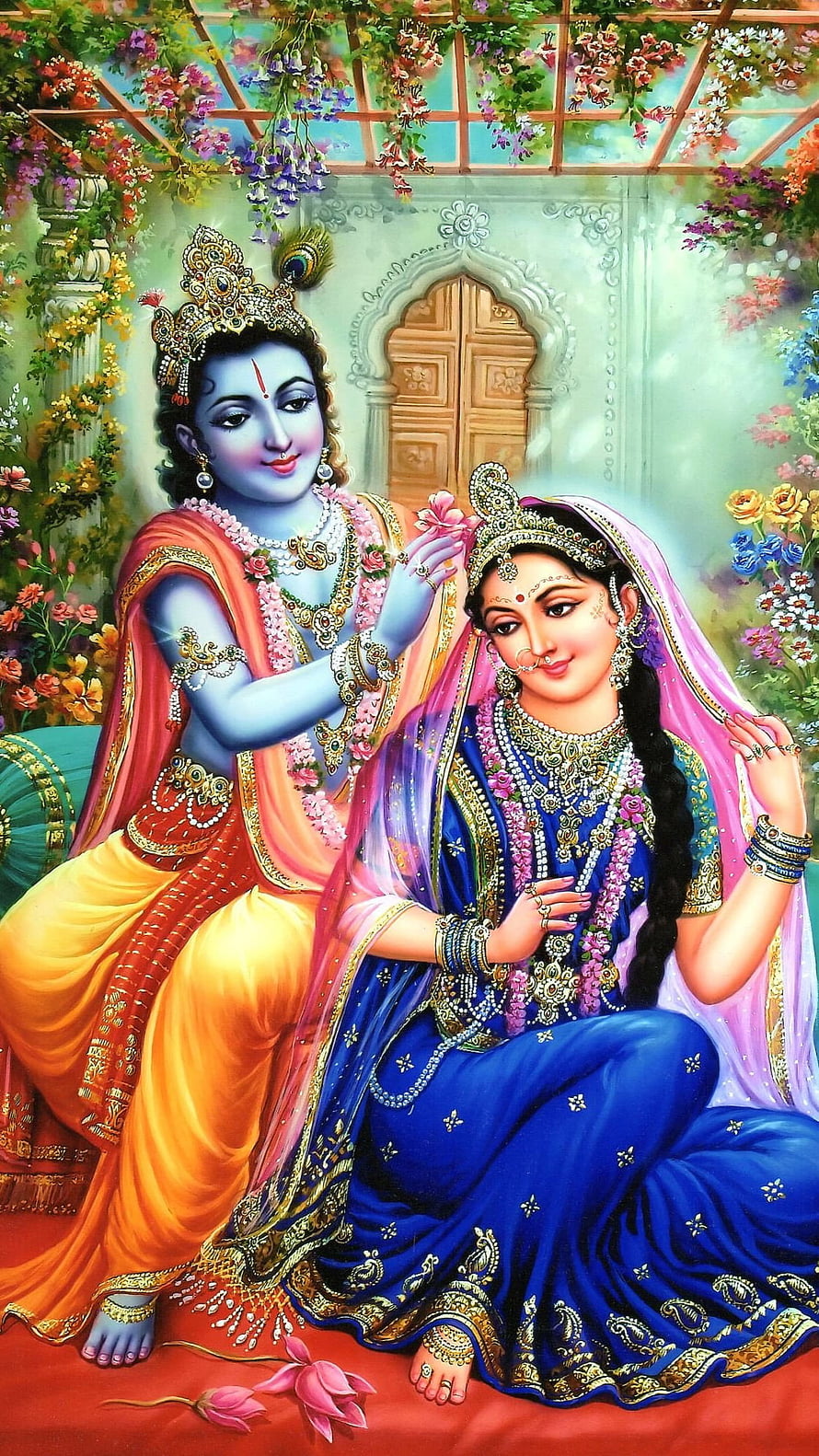 Radha Krishna Sitting Together in a Flower Garden with Peacock Feather Crown HD phone wallpaper