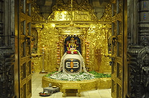 Somnath Mahadev Temple Golden Sanctum with Shiva Lingam and Ornate Carved Architecture HD wallpaper