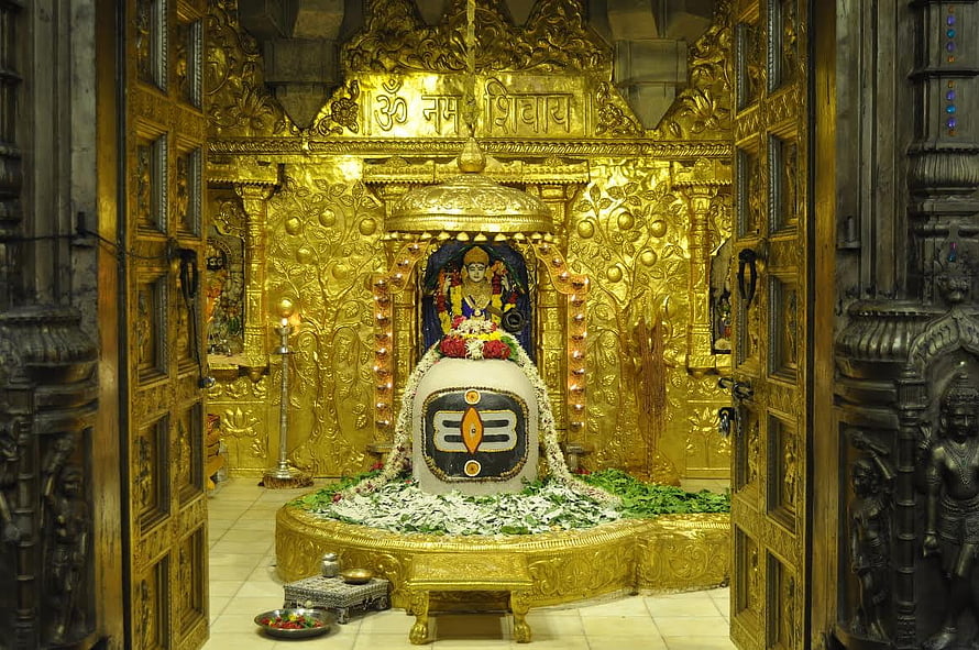 Somnath Mahadev Temple Golden Sanctum with Shiva Lingam and Ornate Carved Architecture HD wallpaper
