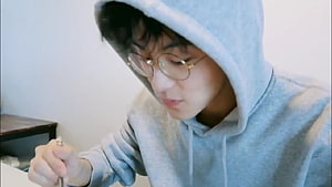 Mark Lee from NCT in a Grey Hoodie and Round Glasses HD wallpaper