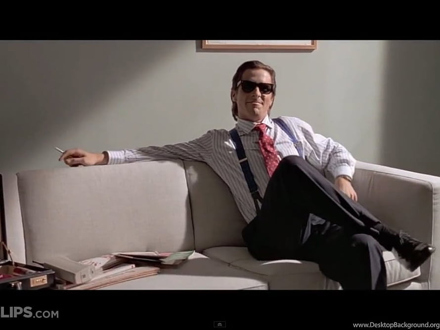 Patrick Bateman from American Psycho relaxing on a white sofa in a minimalist office, American Psycho Background, Patrick Bateman HD wallpaper