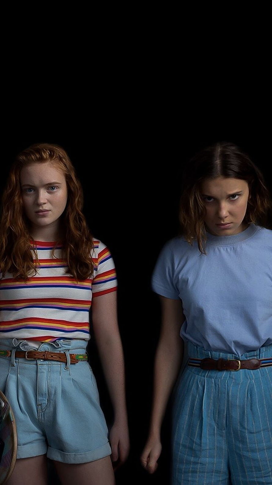 Stranger Things Max and Eleven in 80s Outfits Against Black Background HD phone wallpaper