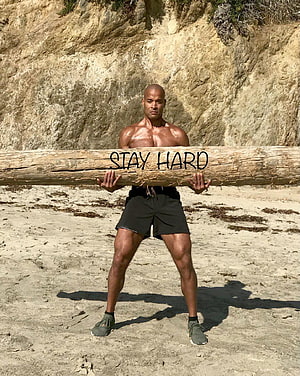 Muscular Man Carrying Heavy Log on Beach with Stay Hard Motivation, David Goggins - for motivation: davidgoggins HD phone wallpaper