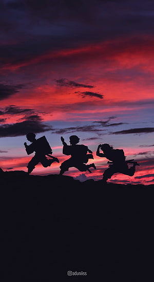 Demon Slayer Silhouettes Running at Sunset with Tanjiro, Zenitsu, and Inosuke HD phone wallpaper