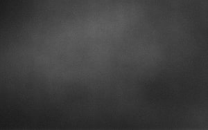 Dark Gray Textured Background With Subtle Grain And Soft Lighting For Desktop HD wallpaper