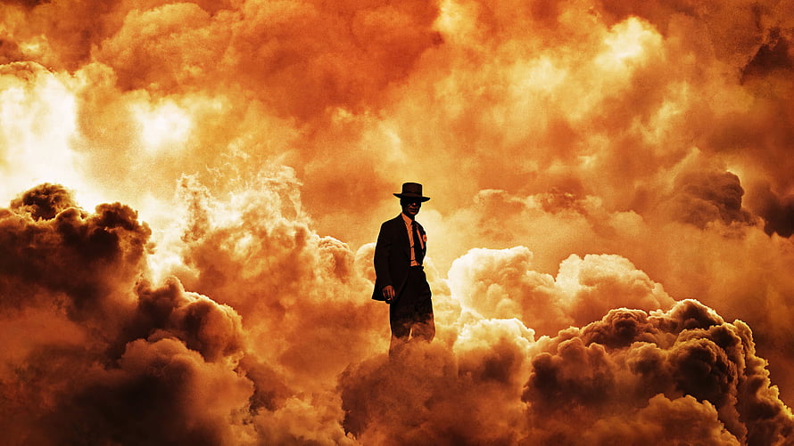 Oppenheimer Cinematic Poster Featuring Silhouette in Fedora Against Dramatic Orange Clouds HD wallpaper